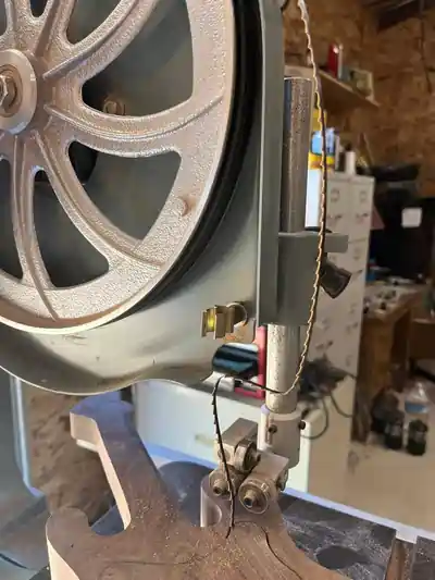 Picture of bandsaw blade broken in the saw