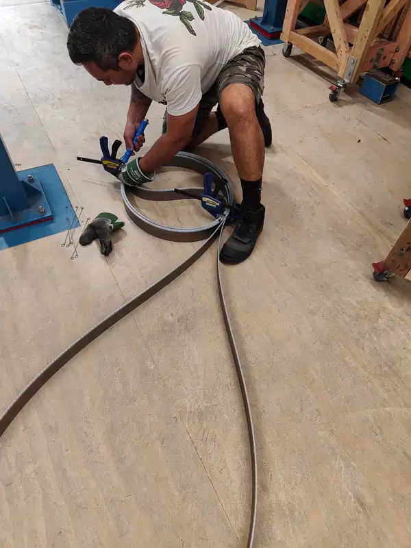 handling oversized bandsaw blade during coiling and clamping